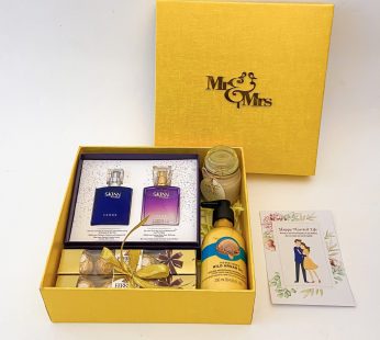 Elegant wedding gift hamper with the the bridal box that includes Couple Perfume , Chocolate and more with blissful greetings!