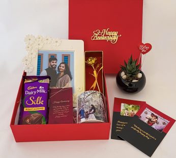 Elegant anniversary gift box for couples with a Dairy Milk , Mug and blissful greetings