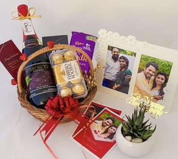 Special anniversary gift hamper with a Wine , Chocolate and blissful greetings 