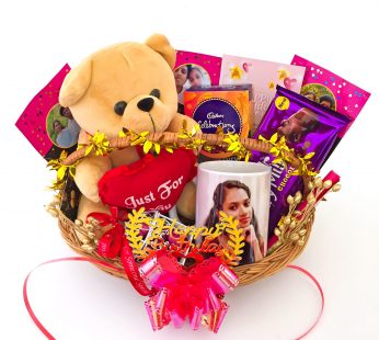 Elegant Birthday gift hamper with teddy bear, diary and a sweet greetings.