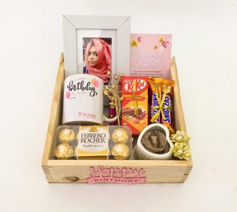 Elegant Birthday gift hamper with lovely Frame, Chocolates and a sweet greetings.