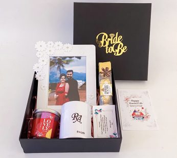 Adorable Birthday gift hamper with lovely frame, scented candle and a sweet greetings.