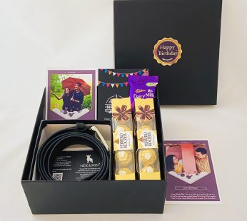 Elegant Birthday gift hamper with Stylish belt, Chocolate and a sweet greetings.