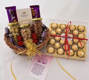Delightful Birthday gift hamper with Tasty nuts bottles,snickers and a sweet greetings.