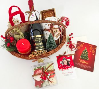 Christmas corporate gift baskets filled with cake, mini xmas tree, fragrance candle, special xmas bag and more
