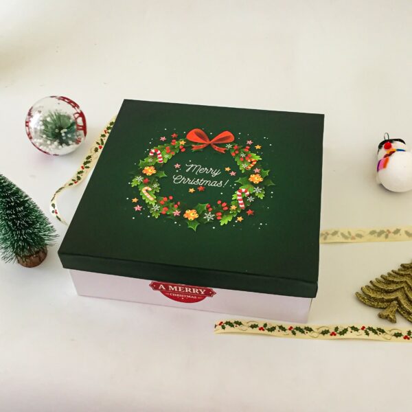 Minimalistic Christmas cake boxes Filled With Rich Plum Cake, Chocolates Grape Juice, And Decor Items - Image 2