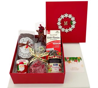 Cute Christmas gift boxes with cake, Chocolate coated cranberries, Wine, And more.