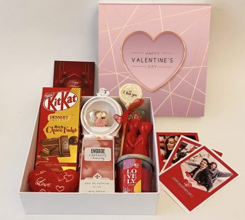 Alluring valentine’s day gift hampers with elegant Couple Dome, Candy, Perfume And Cards