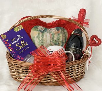 Charming valentine’s day gift hampers with elegant heart pillow, chocolates, juice, mug, candle, and cards