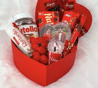Ideal valentine day special gift Hampers With Elegant Teddy, Chocolates, Nutella, Photo Frames, And Cards