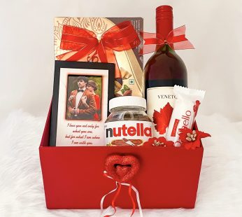 Ideal valentine’s day gift hampers with elegant Photo frame, chocolate, Nutella spread, wine, and cards