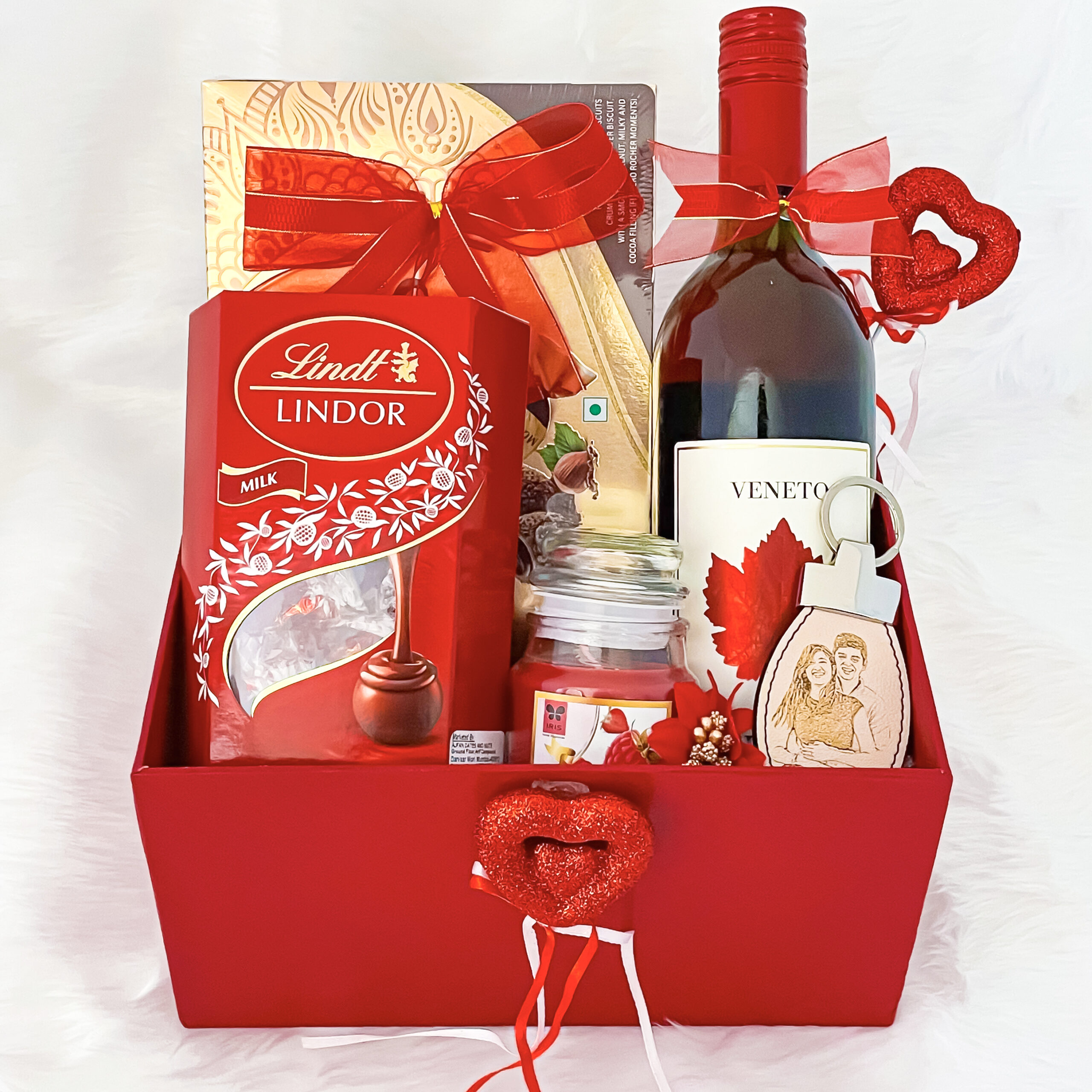 Cute valentines day hampers for with elegant chocolates, keychain, wine, candle, and cards