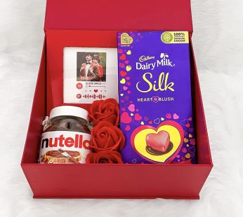Unique valentine’s day gift hamper with elegant photo frame with Spotify music, Artificial Flowers, Chocolates, and cards