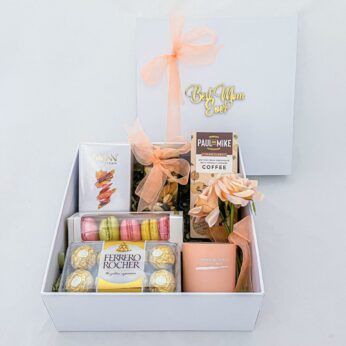 Perfect birthday day gifts for mother filled with artificial flowers, chocolates, & more