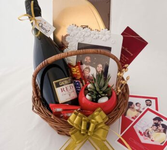 Exciting anniversary gift basket for friends with wine, chocolates, and greetings