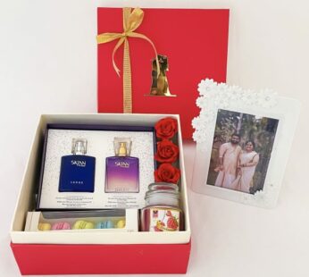 Unique wedding gift for friend includes photo with a frame, perfumes, and macarons