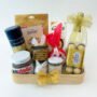 A personalized Easter gift box with a label that reads "Happy Easter" and filled with chocolates and Wine