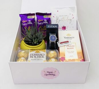 Attractive anniversary gift box for her Entails chocolates, a watch, and perfume