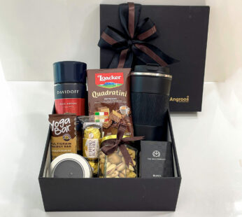 An appealing birthday gift box for friend includes mixed nuts, chocolates, & perfume.