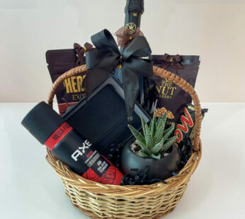 Thank-you gift hamper for him is embellished with wine, perfume, and chocolates.