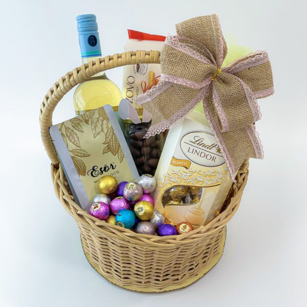 An elegant premium Easter basket featuring a variety of gourmet chocolates and sweets, perfect for indulging in during the holiday season