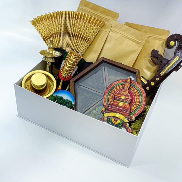 Cherish Traditions with the finest Onam gift that contains Nilavilakku, Udayada, and more - Image 2