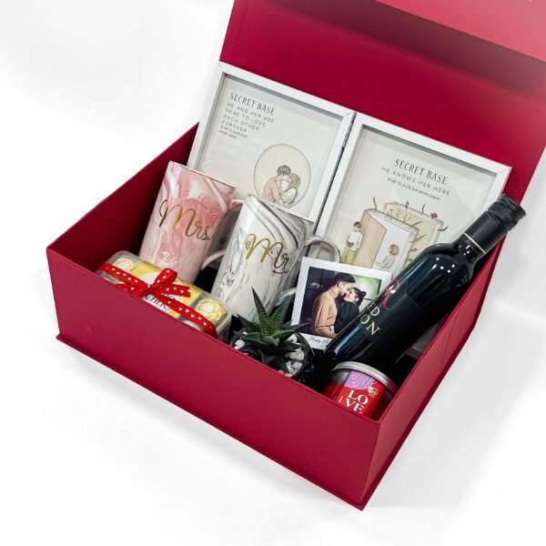 The Ultimate Anniversary Gift Box with Mr and Mrs Mugs, Book Photo Frame, Ferrero Rocher, Red Noon, Scented Candle, Plant and Pot, and Greeting Card - Image 2
