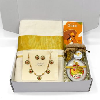 Graceful Onam Saree Gift Box with Floral Jewelry & Candle