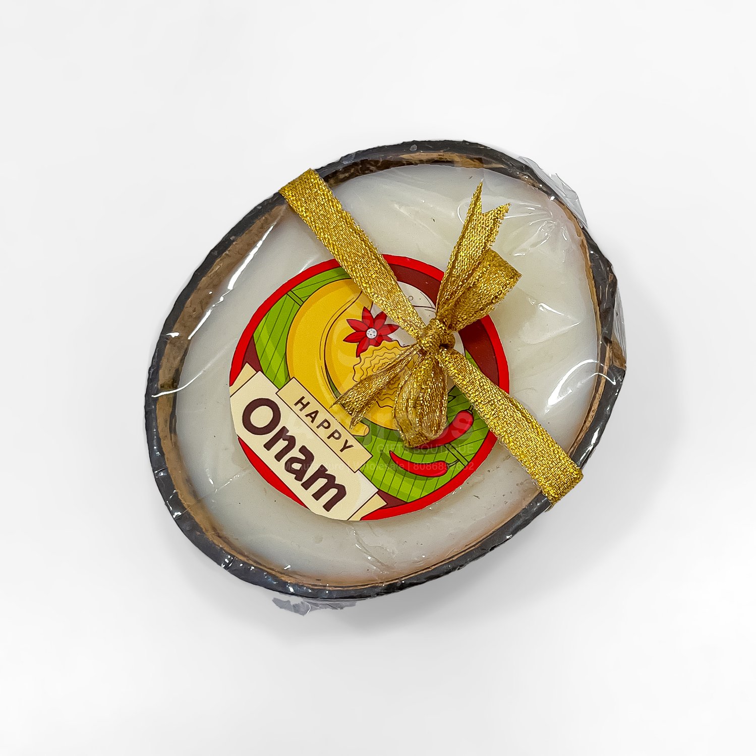 Coconut shell candle With onam badge