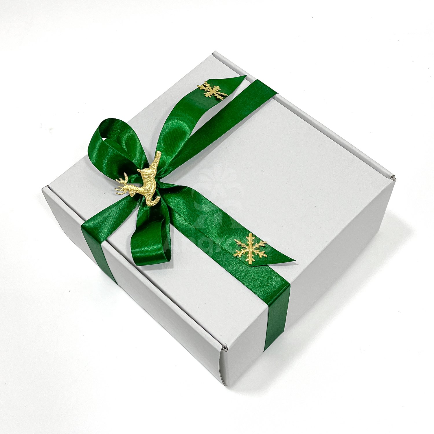 White box with green ribbon