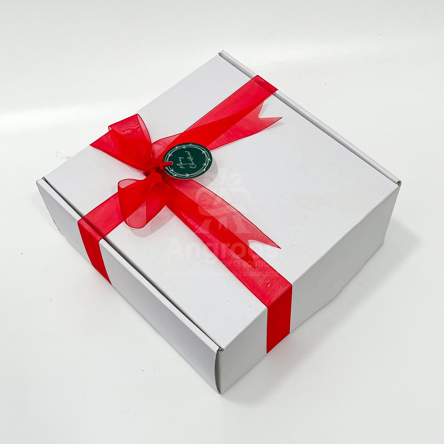White box with red ribbon